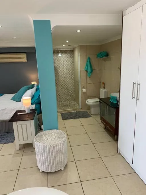 Modern en-suite bathroom with walk-in shower and contemporary design elements