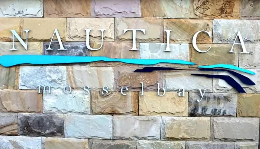 Nautica Messelbay property signage on decorative stone wall