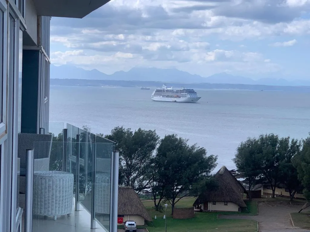 Ocean view with cruise ship and mountains from property deck