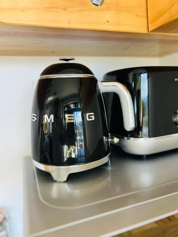 Black SMEG kettle and toaster on kitchen counter
