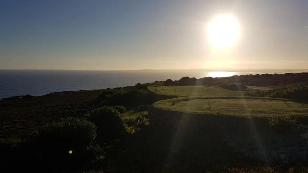 Panoramic ocean and lagoon view at sunset from the hillside property