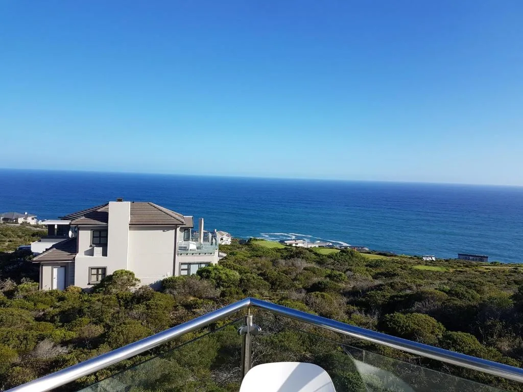 Panoramic ocean and coastline vista from elevated cliffside property