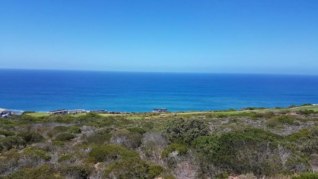 Panoramic view of turquoise ocean and coastline from elevated property position