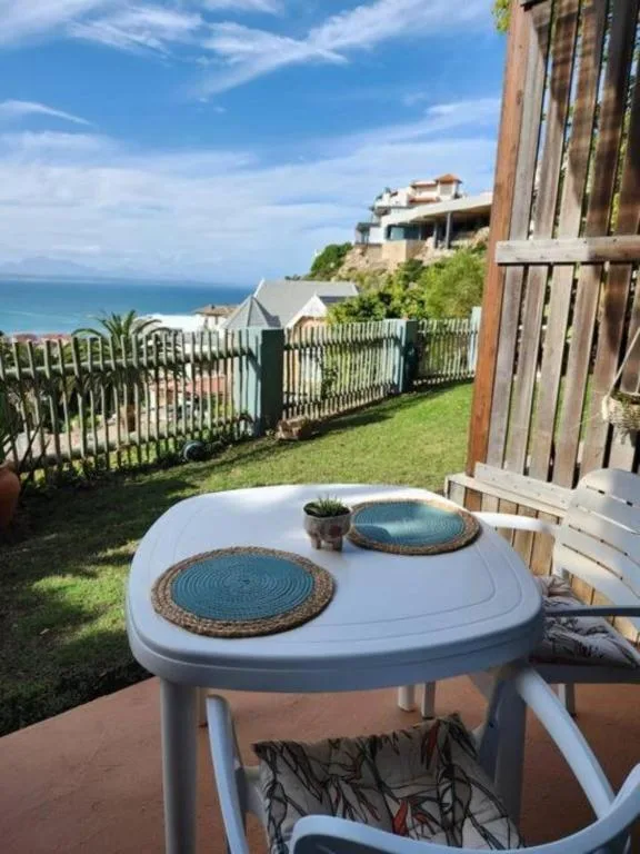 Ocean view from garden deck with coastal landscape and blue sea
