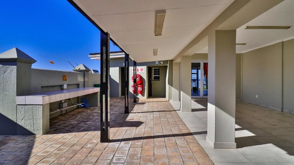 Spacious covered patio with braai area and ocean views, Mossel Bay