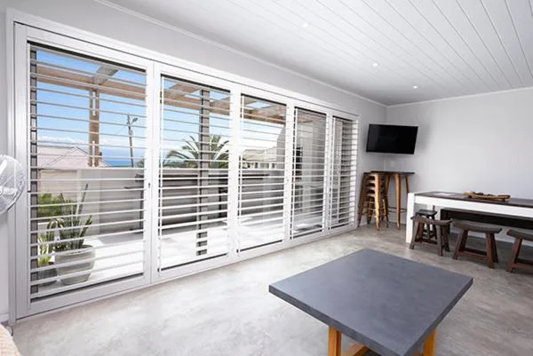 Modern deck with sliding doors and panoramic coastal views of Mossel Bay