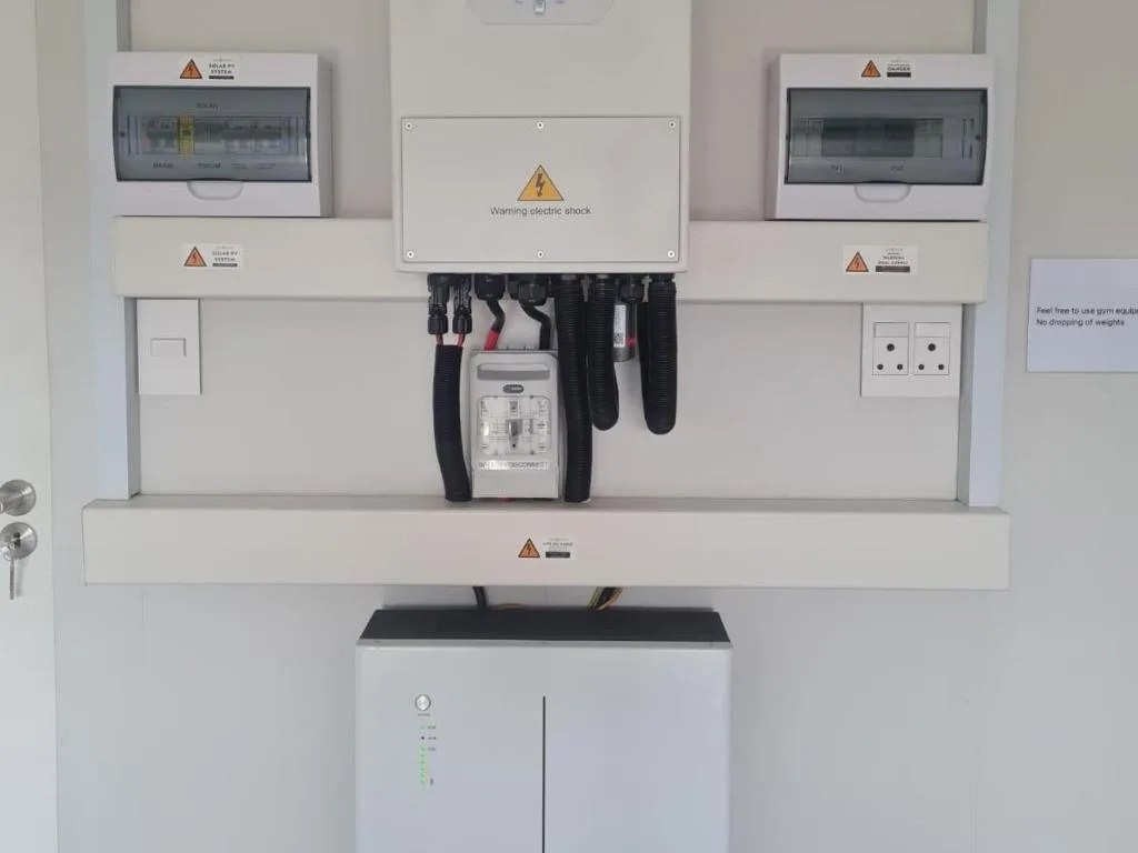 Electrical switchboard and circuit breakers with safety warning labels mounted on wall