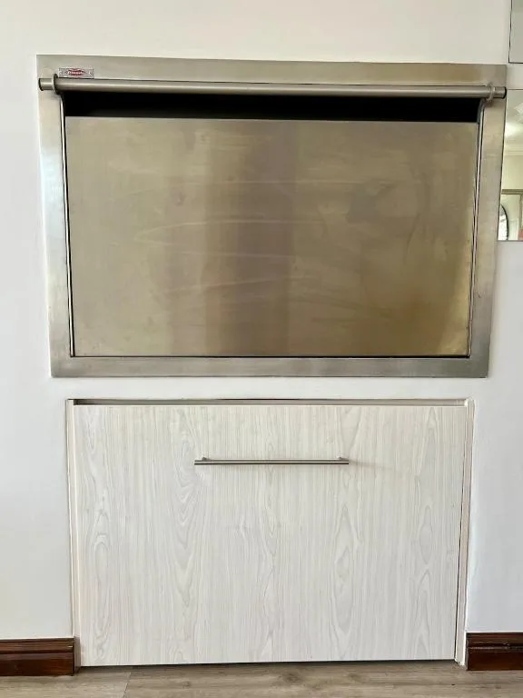 Modern dishwasher with stainless steel interior and white wood-grain exterior panel